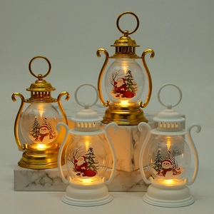 Detail of Christmas lantern with Santa and Snowman prints on warm LED light display