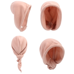 Detail views of soft pink knitted scarf hat showing fabric texture and tie closure