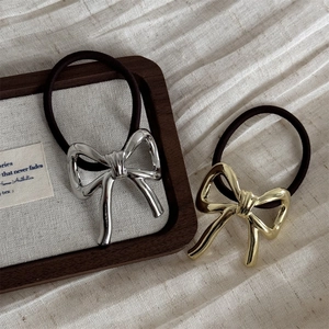 Elegant metal bow hair ties in gold and silver finish with high-elastic bands