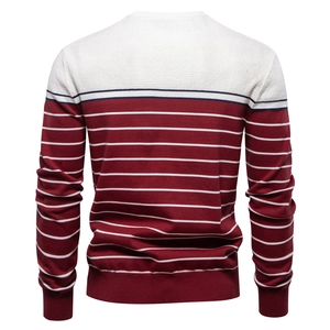 Detail view of the back of this men's striped knit sweater showing color block stitching