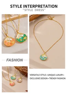Detail of colorful enamel shell pendants with pearl accents on gold stainless steel chain
