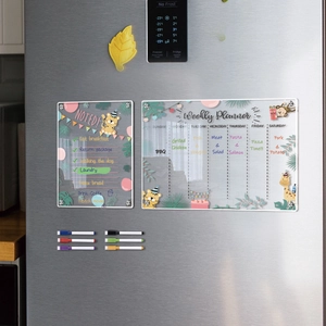 Magnetic acrylic weekly planner set with jungle animal motifs on a stainless steel fridge