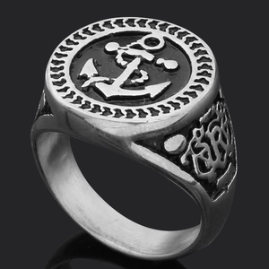 Detailed view of vintage silver Viking ring featuring embossed anchor and engraved SR design