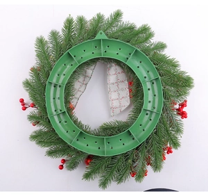 Detail view of the durable green plastic support ring and back hook of the Christmas wreath