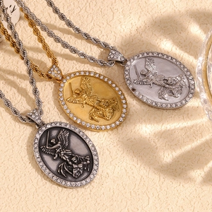 Detailed view of angel necklaces in gold, silver and black with sparkling crystal halos