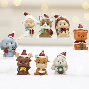 Set of 7 cute resin Christmas animal figurines including reindeer and elephant with gift box