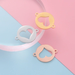 Mirror polished stainless steel heart charms in gold, silver, and rose gold finishes
