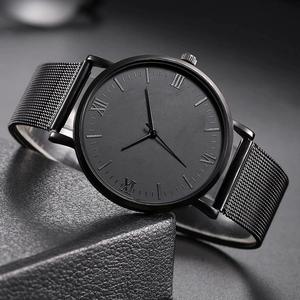 Side view of men's minimalist quartz watch with black mesh strap and Roman numerals