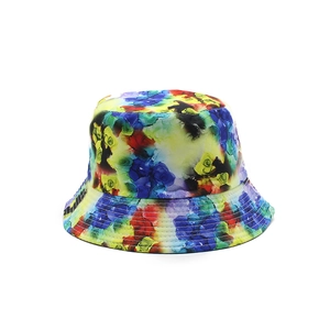 Reversible bucket hat featuring a vibrant watercolor tie-dye print with a wide sun brim