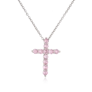 Close-up of a delicate silver chain necklace with a cross pendant set with pink zircons