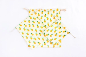 Three-piece set of cream drawstring pouches with yellow pineapple polka dot patterns