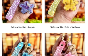 Detail of starfish shaped liquid glitter keychains in purple and yellow colors