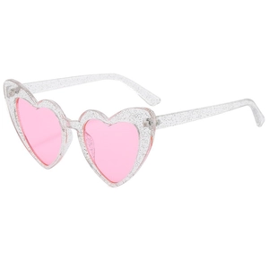 Macro shot of clear heart sunglasses frame with silver glitter and pink lenses