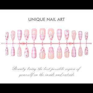 Detail view of 24pcs press-on almond nails featuring plaid patterns and pearl accents