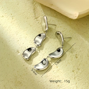 Detail view of heart star earrings showing 5.6cm length and 15g weight dimensions