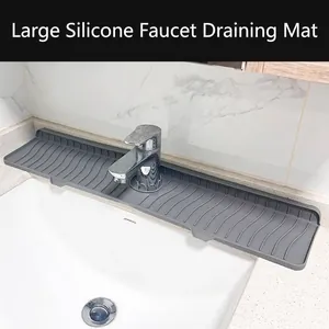 Gray silicone kitchen sink faucet draining mat with large wave splash guard grooves