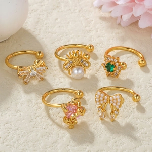 5pcs set of gold ear bone clips with pearls, crystal bees and green gems on white stone