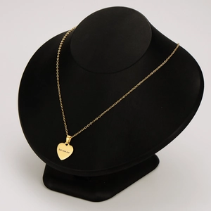 Polished 18k gold heart necklace with Best Mom Ever engraving on a black bust model