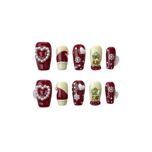 Christmas press-on nails set featuring burgundy snowflake designs and pearl accents