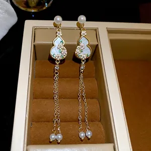 Elegant Chinese style gourd earrings with pink flowers, pearls and long gold tassels