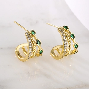 Detail of 18K gold plated hoop earrings with green oval zircon and sparkling accents