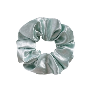 Detailed view of light mint green satin fabric scrunchie with soft silk luster