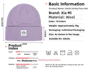 Macro detail of purple knit beanie with smiley face patch showing size and weight info
