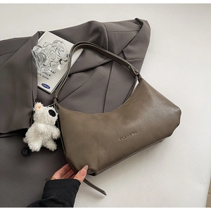 Minimalist dark brown PU leather shoulder bag with a cute white plush puppy charm