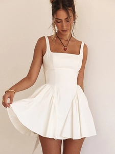Detailed view of white backless mini dress featuring a square neck and corset waist design