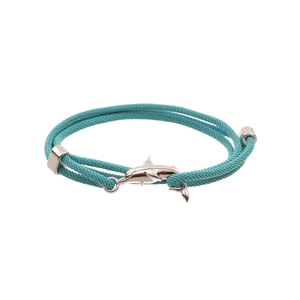 Close-up of double-layer teal braided bracelet with a polished silver shark pendant detail