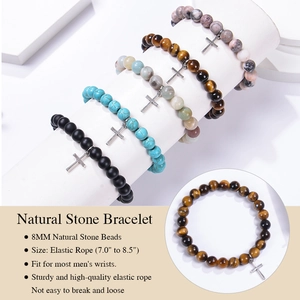 Detail shot of 8mm natural stone beads with a metal cross charm on elastic cord