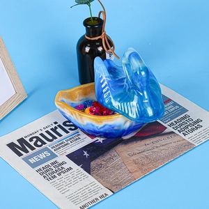 Detail of swan storage box with blue marble resin texture and gold rim highlights