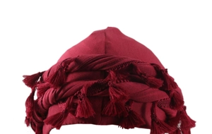 Close-up of deep red beanie featuring a unique small tassel texture and premium fabric