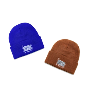 Royal blue and brown knit beanies with cute anime eye embroidery and Japanese text