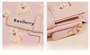 Detail of pink PU leather wallet with cute bear print and golden hardware zipper