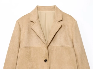 Detail of camel suede blazer showing notched lapel, texture and stitching quality