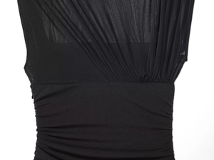 Detail of black mesh patchwork with ruched texture on a chic stand collar dress