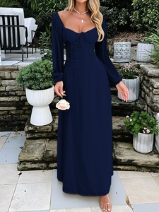 Detail of elegant dark blue maxi dress featuring a square neckline and lace-up bodice design