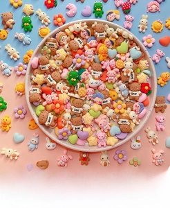 Macro shot of 3D resin cartoon charms in pastel colors for DIY phone cases and mugs