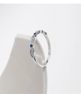 Macro shot of S925 silver ring with blue and white stones showing the S925 hallmark