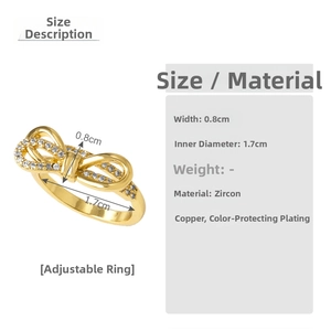 Detail of gold bow ring with cubic zirconia inlay and adjustable open band design