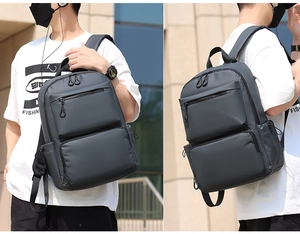 Wasserabweisender dunkelgrauer Rucksack mit mehreren Reißverschlusstaschen für Laptops
