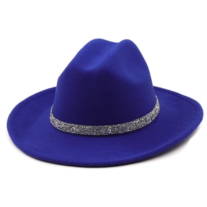 Detailed shot of cobalt blue felt fedora featuring a silver glitter hatband trim
