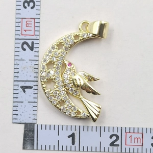 Detailed view of crescent moon pendant necklace with size scale on white background