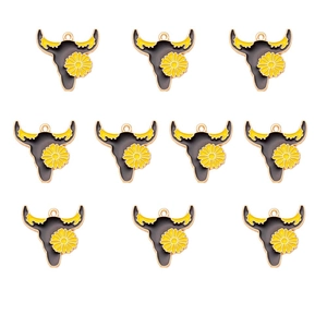 Macro view of 10 pieces black alloy bull head charms with yellow flower details