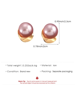 Detail view of large pink pearl earrings with gold hammered metal base and dimensions