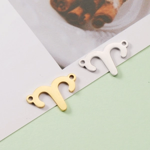 Macro view of gold and silver stainless steel 15mm Aries zodiac pendant connectors