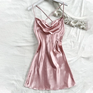 Pink satin slip dress with cowl neck and cross-back straps for a sexy loungewear look