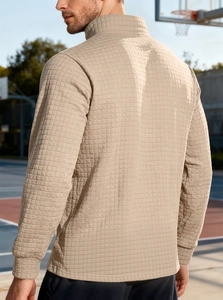 Detail view of almond waffle texture and rib cuffs on men half-zip sweatshirt