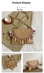 Detail of bohemian straw woven bag featuring colorful tassels and decorative pom-poms